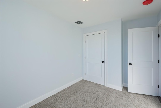 unfurnished bedroom with light carpet