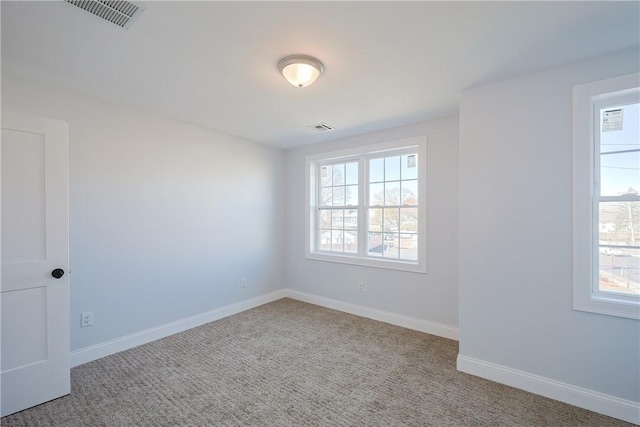 unfurnished room featuring carpet flooring