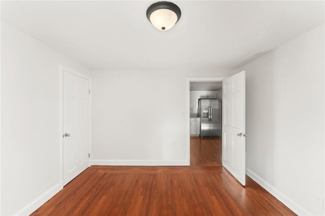 empty room featuring dark hardwood / wood-style floors