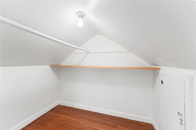 bonus room featuring lofted ceiling and wood-type flooring