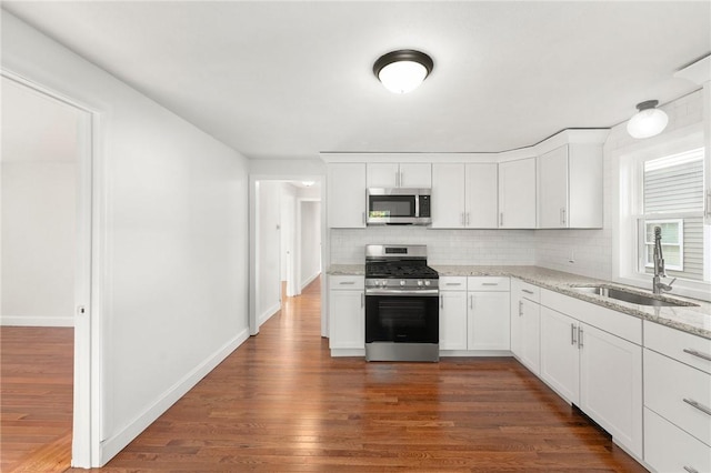 kitchen featuring white cabinetry, sink, and stainless steel appliances