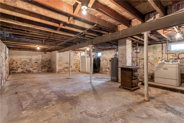 basement with washing machine and dryer and water heater