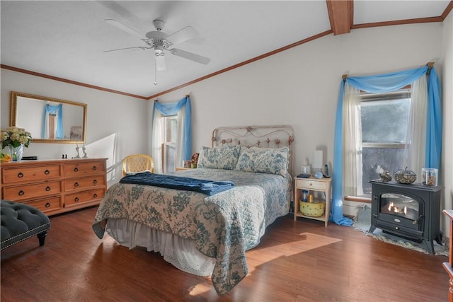 bedroom featuring a wood stove, ceiling fan, wood-type flooring, and vaulted ceiling with beams