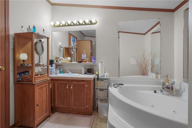 bathroom featuring vanity, crown molding, and a tub