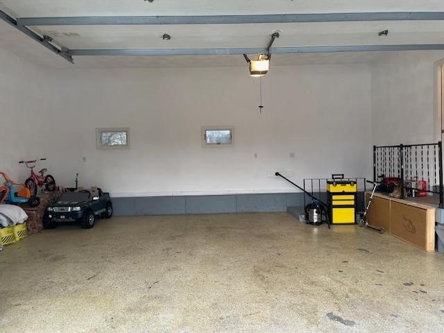 garage featuring a garage door opener