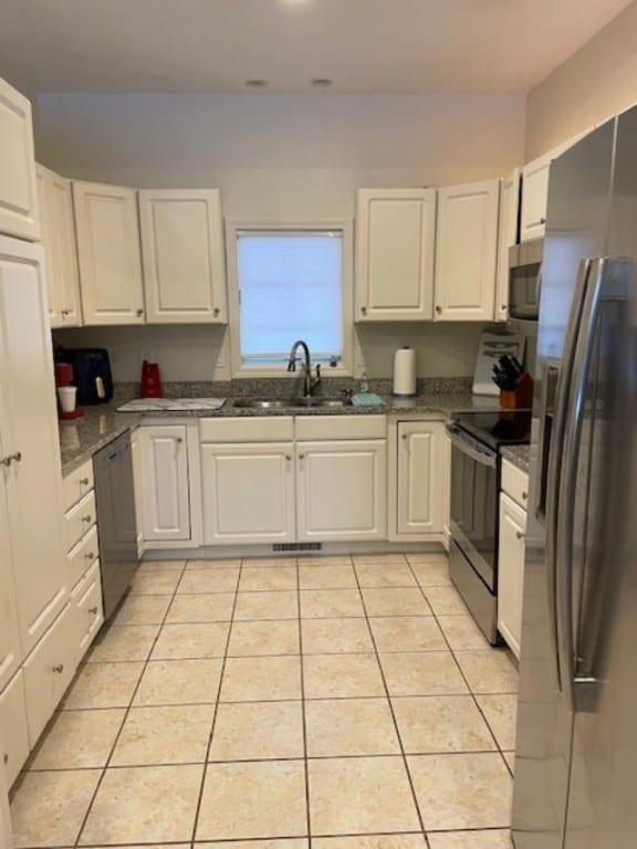 kitchen featuring white cabinets and stainless steel appliances