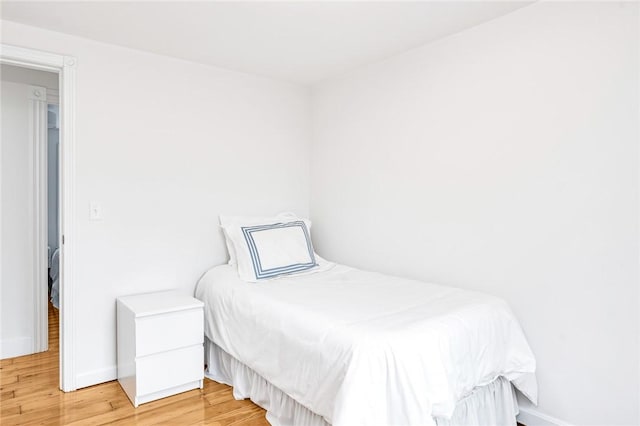 bedroom featuring wood-type flooring