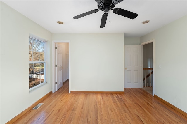 unfurnished room featuring ceiling fan and light wood-type flooring