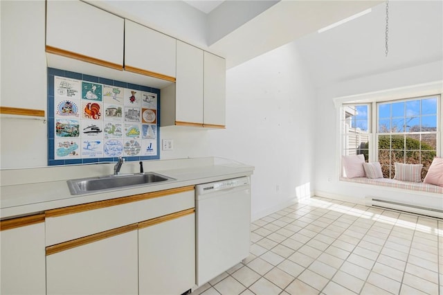 kitchen with white dishwasher, light tile patterned flooring, white cabinetry, and sink