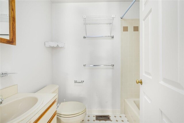 bathroom with tile patterned floors, vanity, and toilet