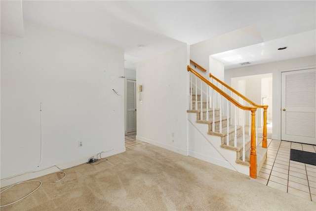 unfurnished living room with light carpet