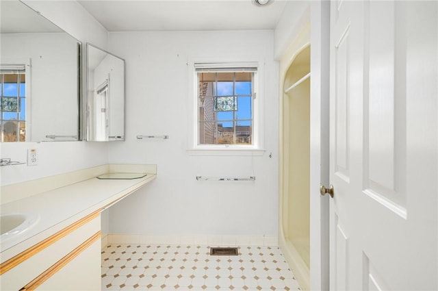 bathroom with vanity and walk in shower