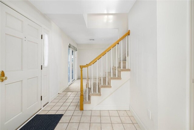 foyer featuring light tile patterned flooring