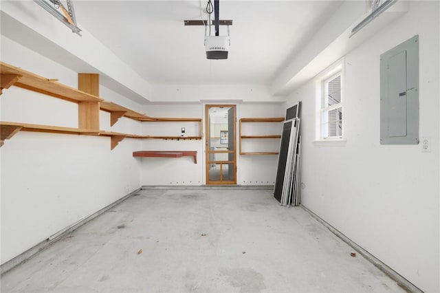 garage featuring a garage door opener and electric panel