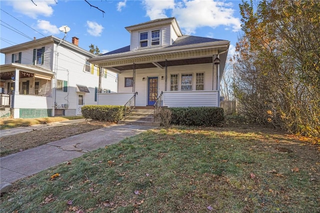 view of front of property with a porch and a front yard