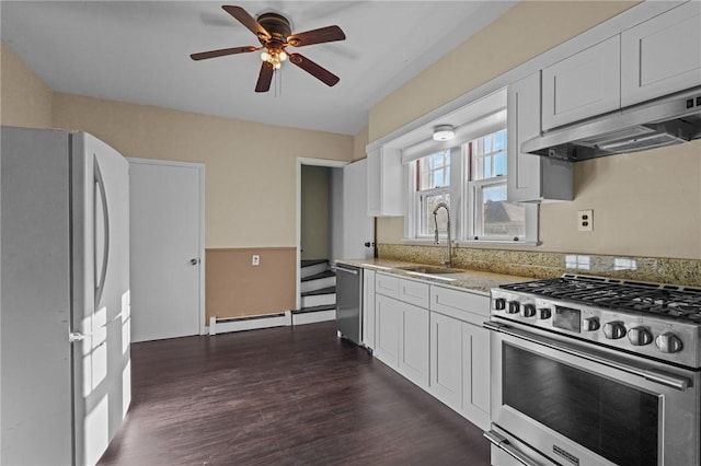 kitchen with dark hardwood / wood-style flooring, white cabinetry, sink, and stainless steel appliances