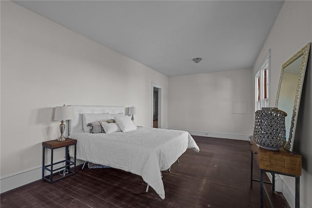 bedroom featuring dark hardwood / wood-style flooring