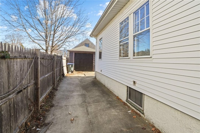 view of side of property featuring a patio