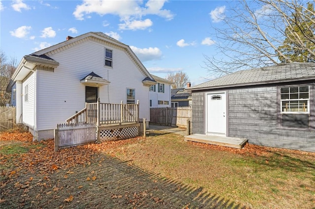 rear view of property with a yard