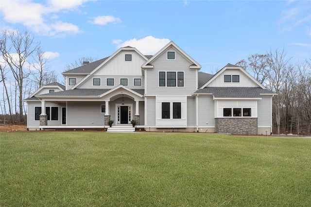 craftsman-style house with a front lawn