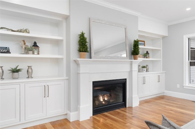 details with hardwood / wood-style floors, built in shelves, and ornamental molding