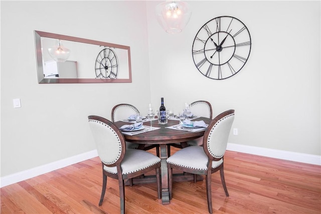 dining area with light hardwood / wood-style floors