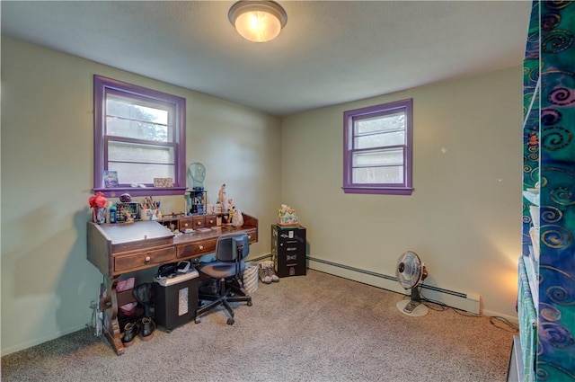 carpeted home office with baseboard heating and a healthy amount of sunlight