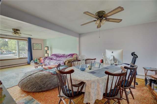 dining room with ceiling fan, light wood-type flooring, and a baseboard heating unit