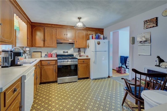 kitchen featuring sink and white appliances