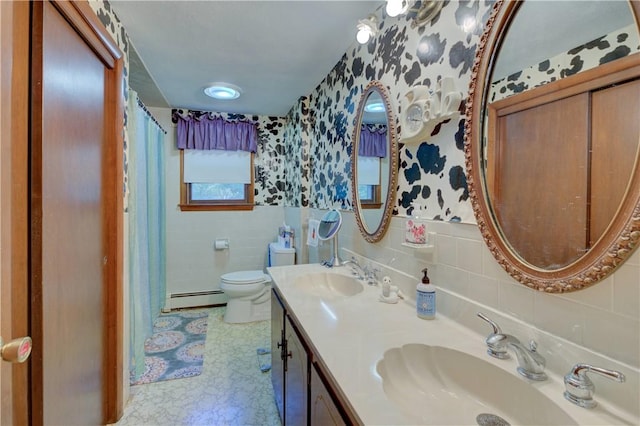 bathroom featuring vanity, a baseboard radiator, toilet, and tile walls