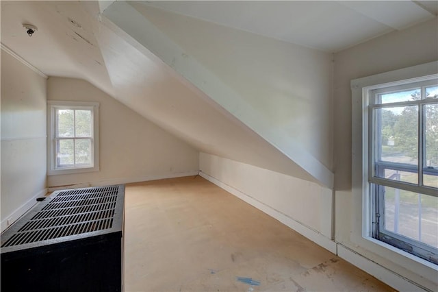 bonus room featuring lofted ceiling and a healthy amount of sunlight