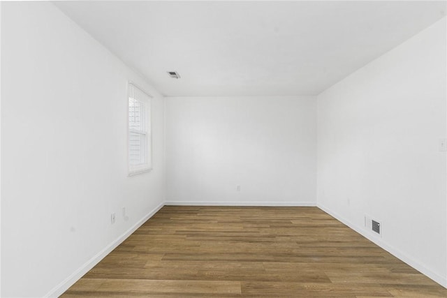 empty room featuring hardwood / wood-style floors