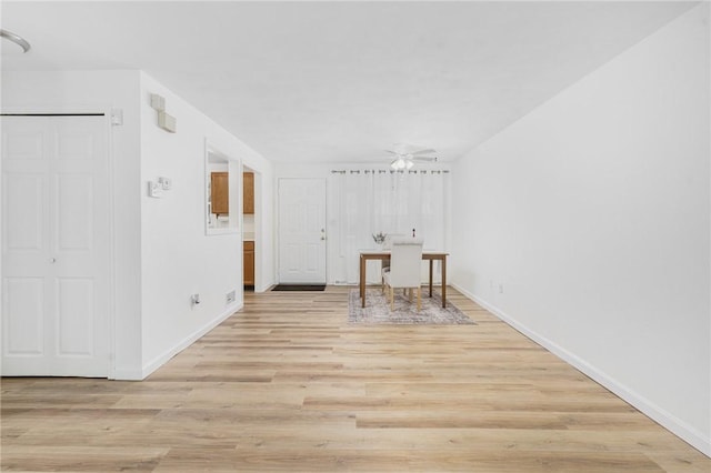 spare room with ceiling fan and light hardwood / wood-style floors