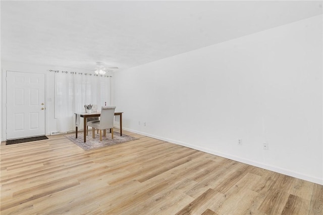 interior space with light hardwood / wood-style flooring and ceiling fan