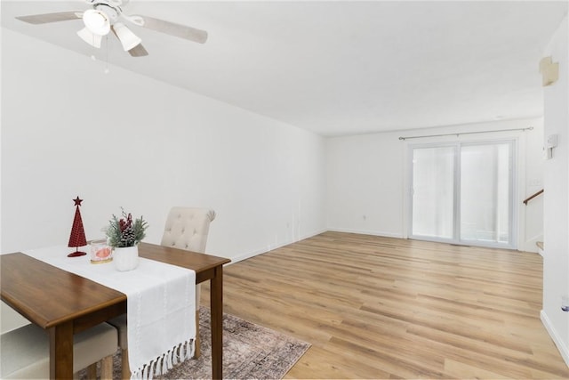 dining room featuring ceiling fan and light wood-type flooring