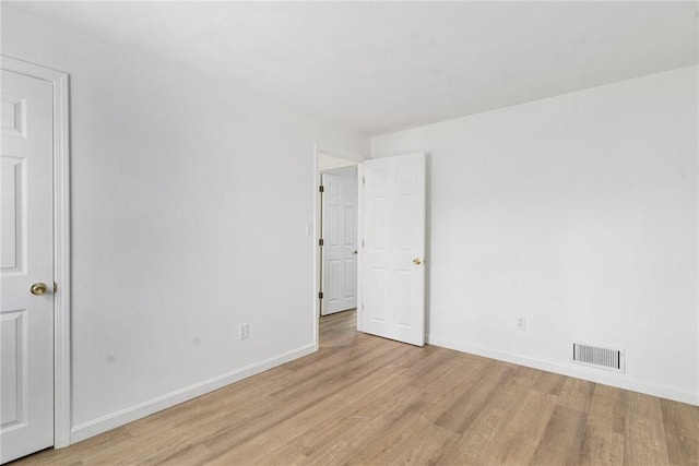 unfurnished room featuring light hardwood / wood-style flooring