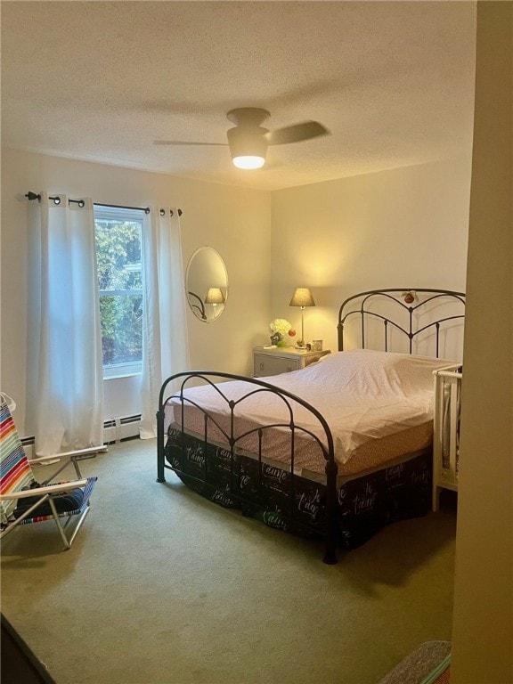 bedroom with carpet, a textured ceiling, a baseboard radiator, and ceiling fan