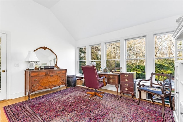 office featuring wood-type flooring and high vaulted ceiling