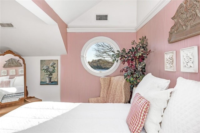 bedroom with vaulted ceiling and crown molding