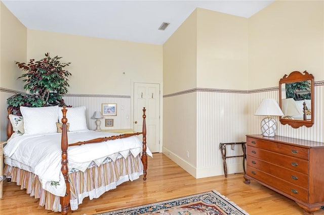 bedroom with light hardwood / wood-style flooring