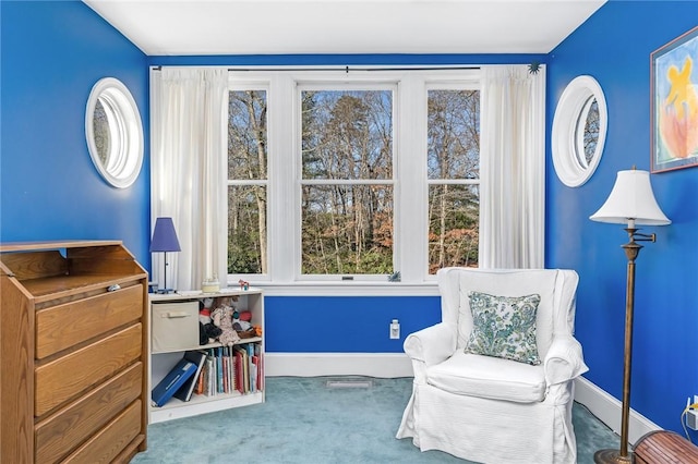 living area featuring carpet floors