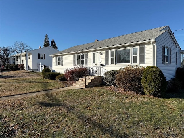 ranch-style house featuring a front yard