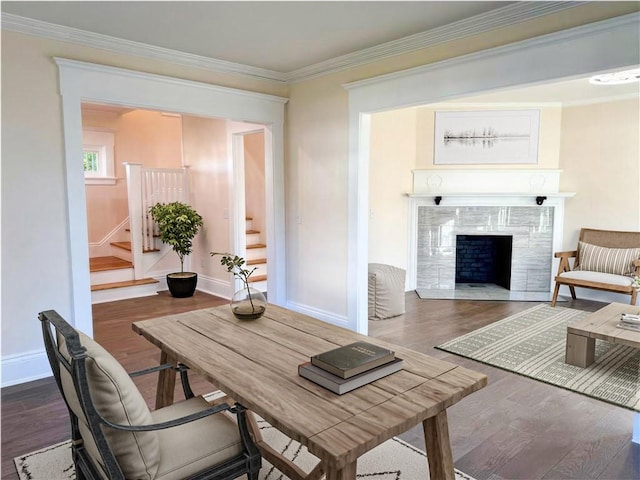 interior space featuring crown molding, a fireplace, and dark wood-type flooring