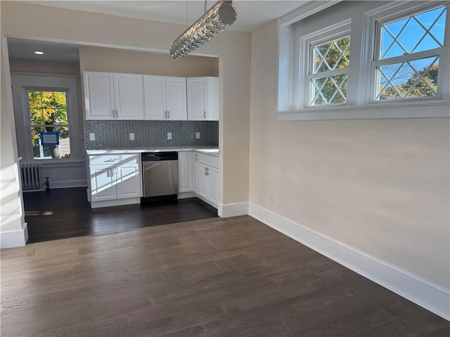 kitchen with white cabinets, dishwasher, a healthy amount of sunlight, and dark hardwood / wood-style floors