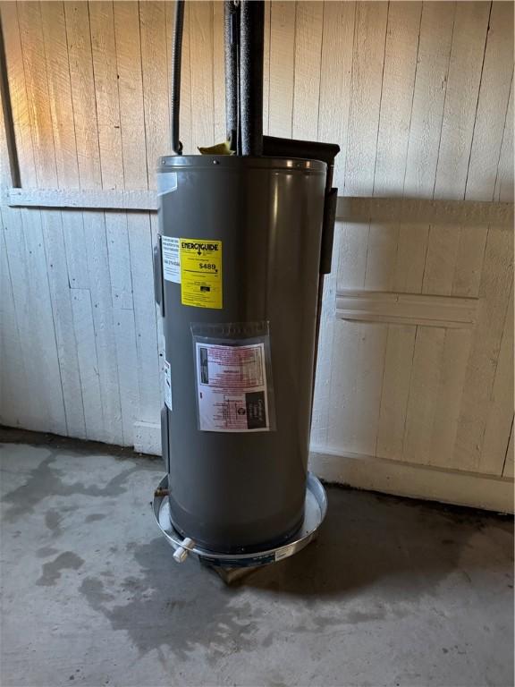 utility room with water heater