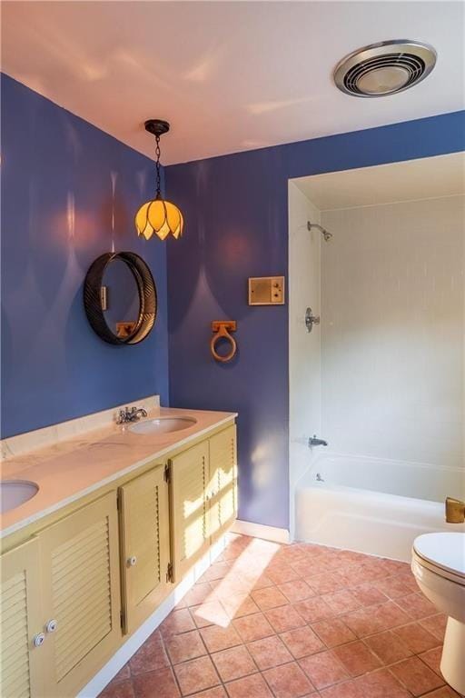 full bathroom featuring tile patterned flooring, vanity, shower / bathtub combination, and toilet