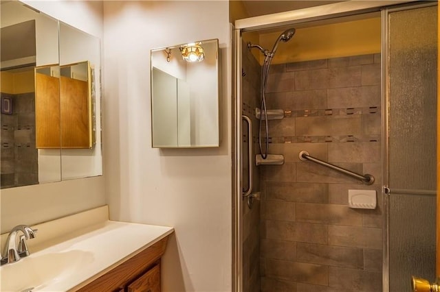 bathroom with vanity and tiled shower