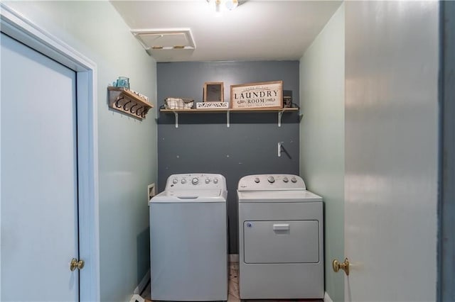 clothes washing area featuring washer and dryer