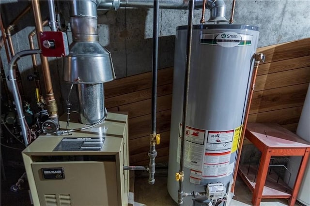 utility room featuring water heater