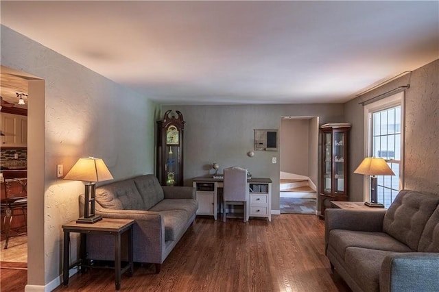 living room with dark hardwood / wood-style flooring